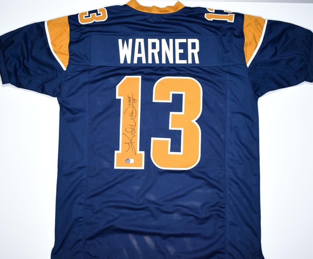Kurt Warner Autographed St. Louis Rams Jersey with Beckett Hologram: Kurt Warner Autographed St. Louis Rams Jersey with Beckett Hologram This is a pre-owned blue and gold pro style jersey, autographed by NFL Hall of Famer Kurt Warner. It is an original piece associated