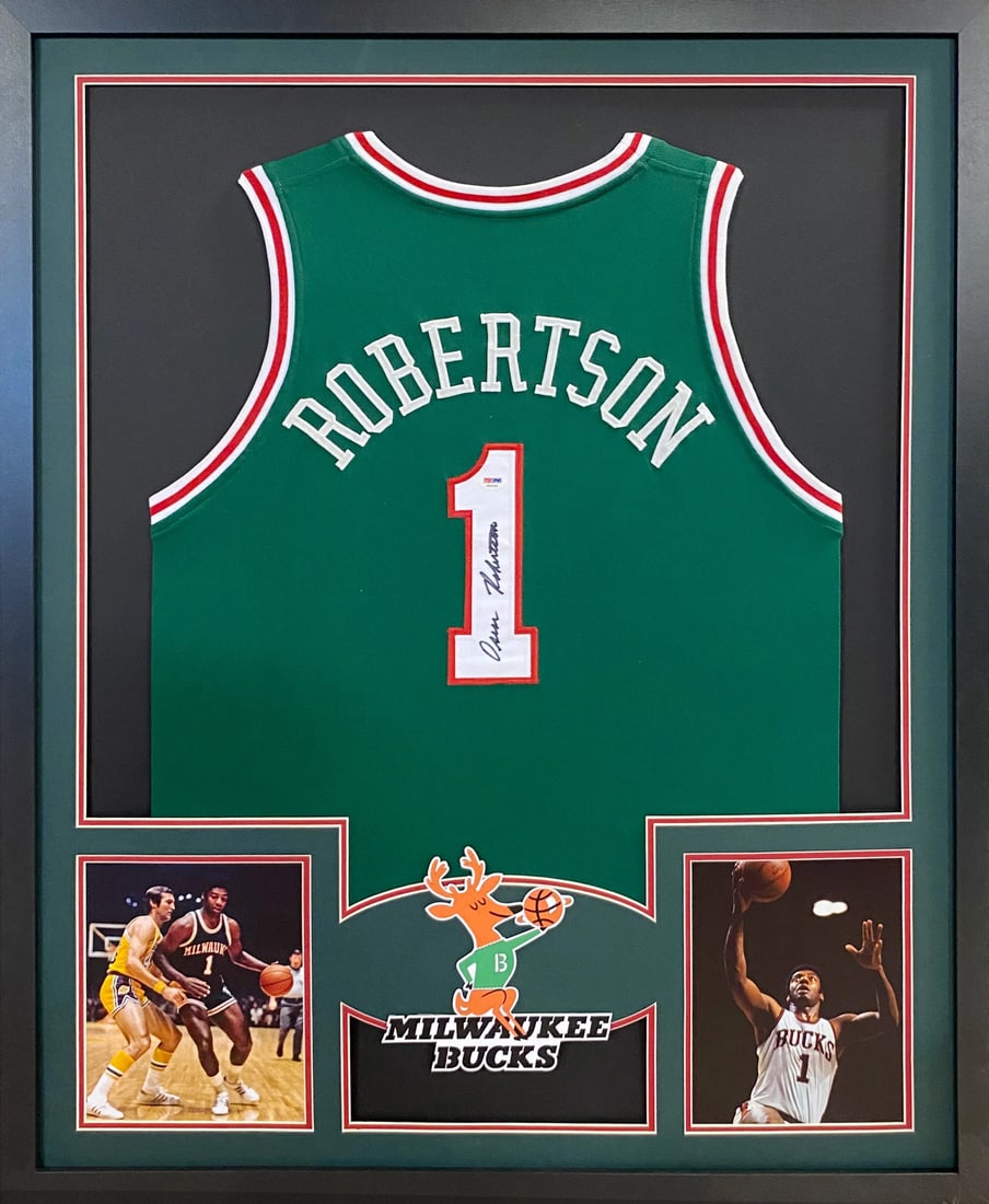 Framed Milwaukee Bucks Jersey Signed by Oscar Robertson PSA DNA Authenticated: Framed Milwaukee Bucks Jersey Signed by Oscar Robertson PSA DNA Authenticated This framed Milwaukee Bucks jersey is autographed by Oscar Robertson and authenticated by PSA/DNA. The display features de