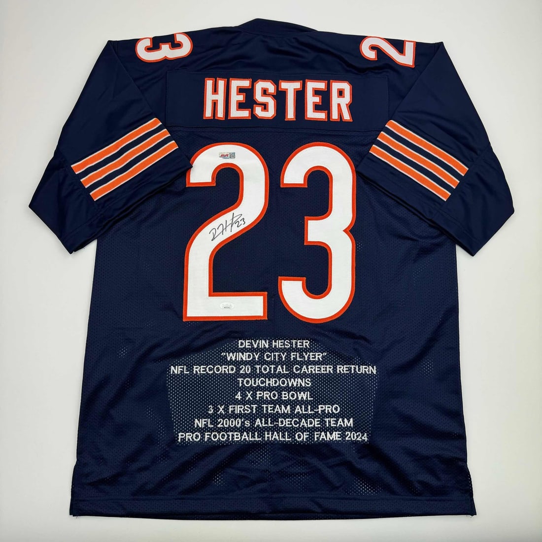 Devin Hester Autographed Chicago Bears Blue Jersey with JSA COA: Devin Hester Autographed Chicago Bears Blue Jersey with JSA COA This autographed football jersey commemorates Devin Hester, a celebrated athlete known for his exceptional skills in the NFL. The jersey