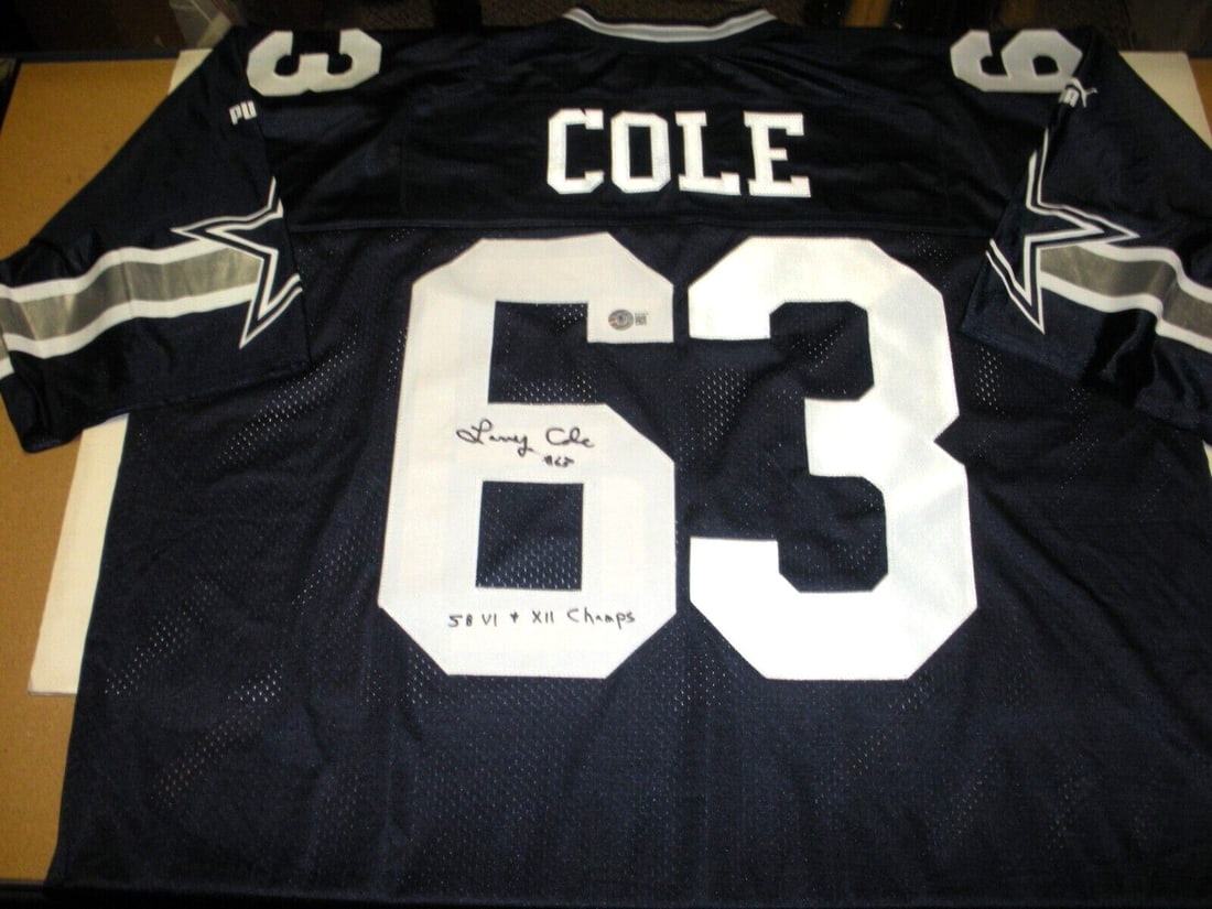 Larry Cole Autographed Dallas Football Jersey with Beckett Authentication by Puma: Larry Cole Autographed Dallas Football Jersey with Beckett Authentication by Puma This is an official licensed Puma Dallas Cowboys jersey signed by Larry Cole. The jersey includes Beckett/COA authenti