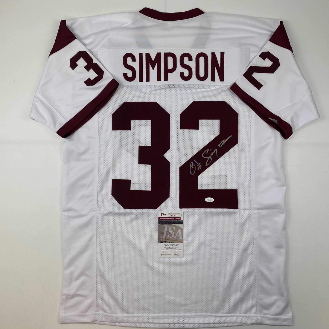 O.J. Simpson Autographed USC Trojans White Football Jersey JSA COA: O.J. Simpson Autographed USC Trojans White Football Jersey JSA COA Celebrate the legacy of O.J. Simpson with this autographed USC Trojans white football jersey. This custom jersey features Simpson's n