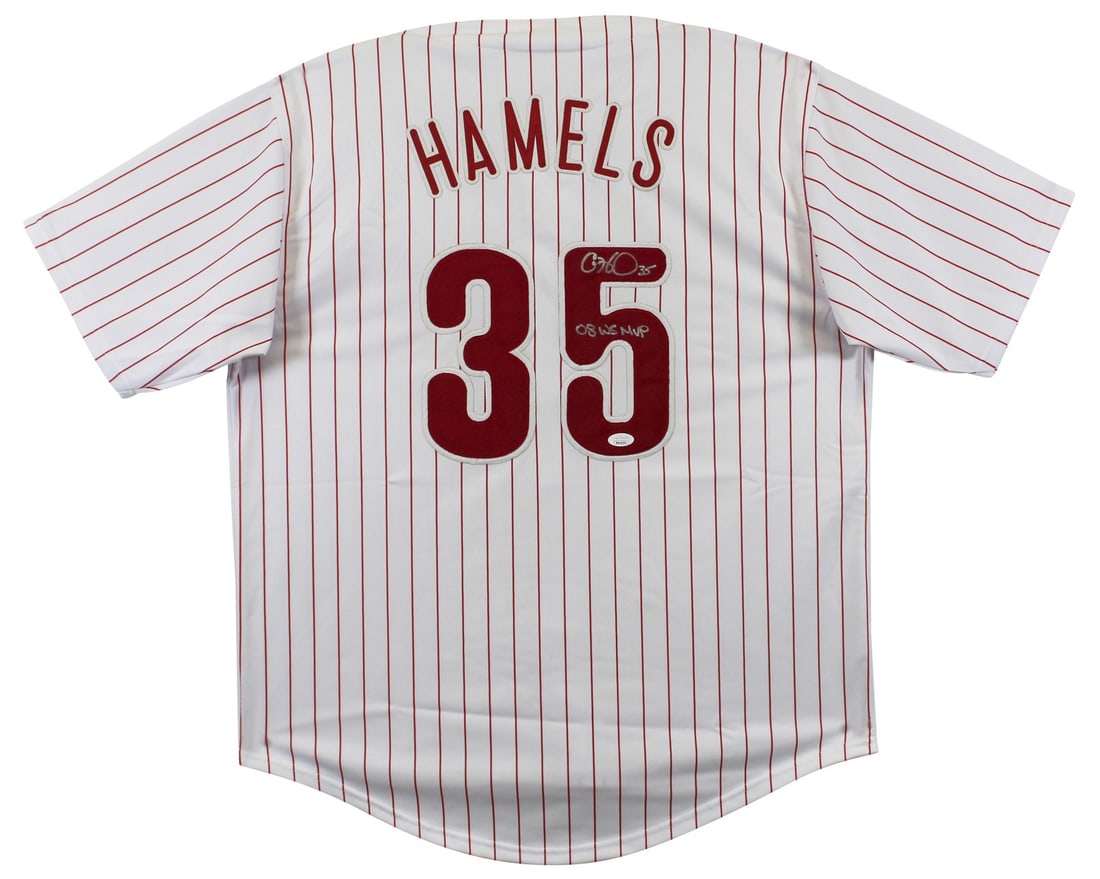 Cole Hamels Autographed Phillies White Pinstripe Jersey With 08 WS MVP Inscription JSA: Cole Hamels Autographed Phillies White Pinstripe Jersey With 08 WS MVP Inscription JSA This white pinstripe pro style jersey features a personal signature from Cole Hamels, including the inscription "