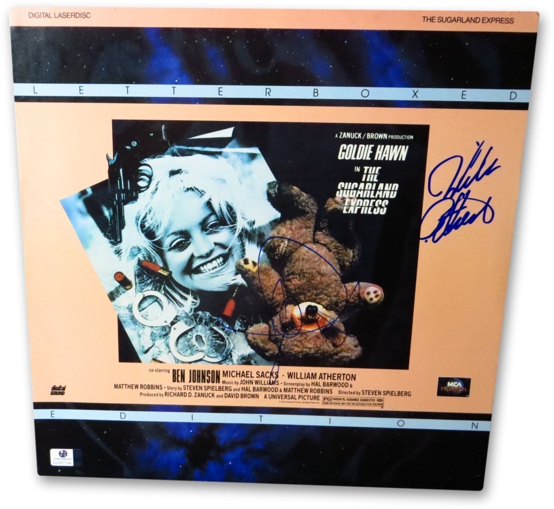 Goldie Hawn William Atherton Signed Sugarland Express Laserdisc Cover JSA: Goldie Hawn William Atherton Signed Sugarland Express Laserdisc Cover JSA This is an original DVD cover of the film 'Sugarland Express' featuring the autographs of Goldie Hawn and William Atherton. Th