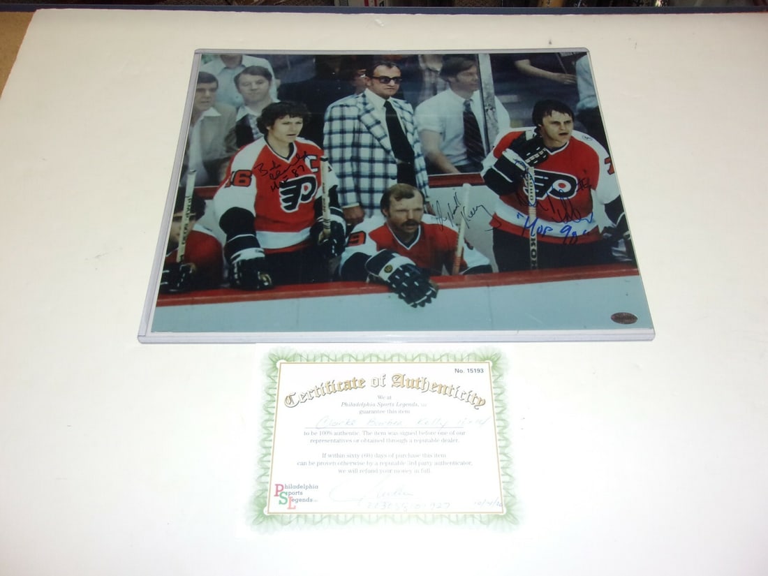 Philadelphia Flyers HOF 11x14 Signed Photo Clarke Barber Kelley with COA: Philadelphia Flyers HOF 11x14 Signed Photo Clarke Barber Kelley with COA This is an original 11x14 photograph featuring Bob Clarke, Bill Barber, and Kelley of the Philadelphia Flyers. The photo has be
