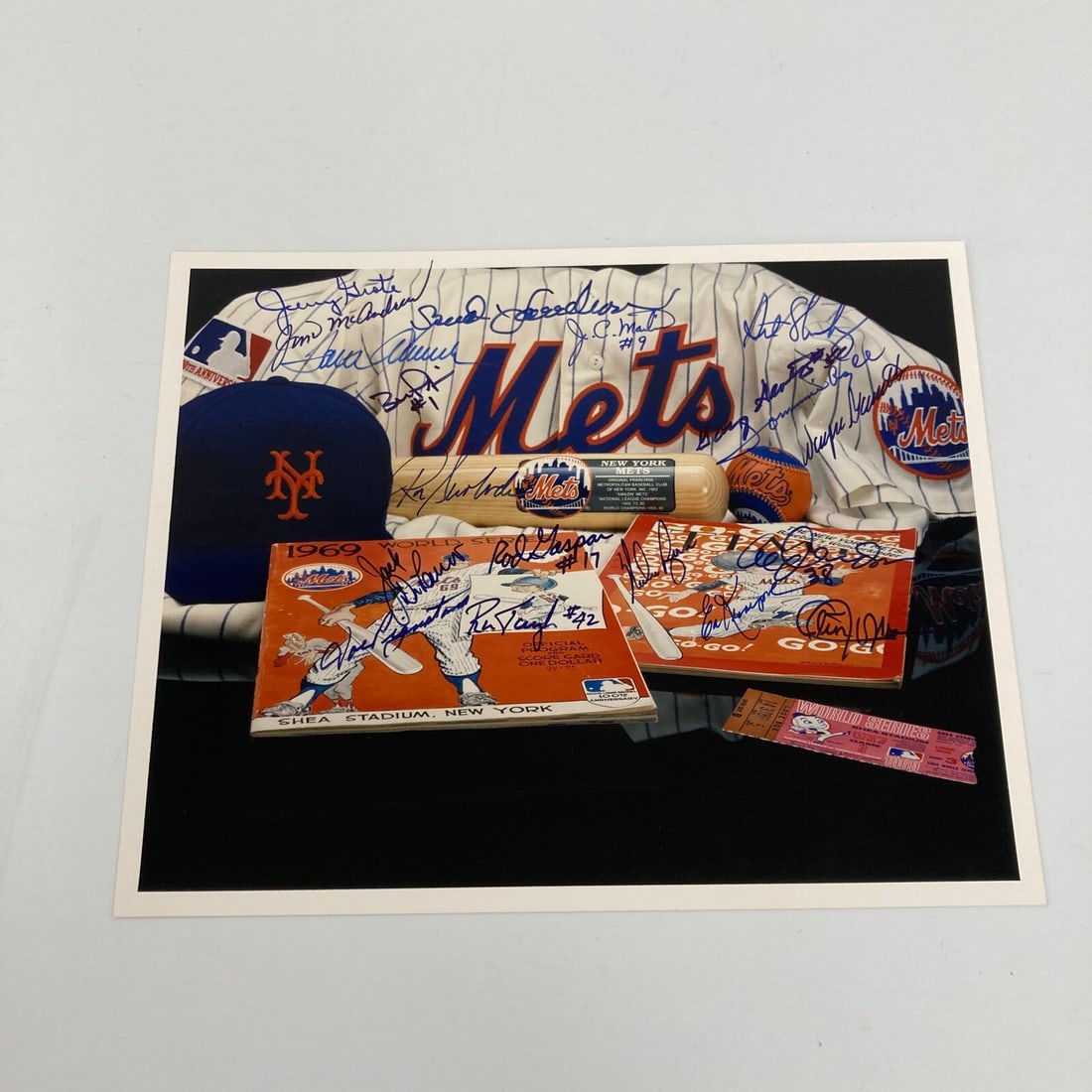 1969 New York Mets Team Signed 8x10 Photo with Nolan Ryan and Tom Seaver: 1969 New York Mets Team Signed 8x10 Photo with Nolan Ryan and Tom Seaver Celebrate the historic 1969 New York Mets with this original team-signed 8x10 photograph. This vibrant color photo features the