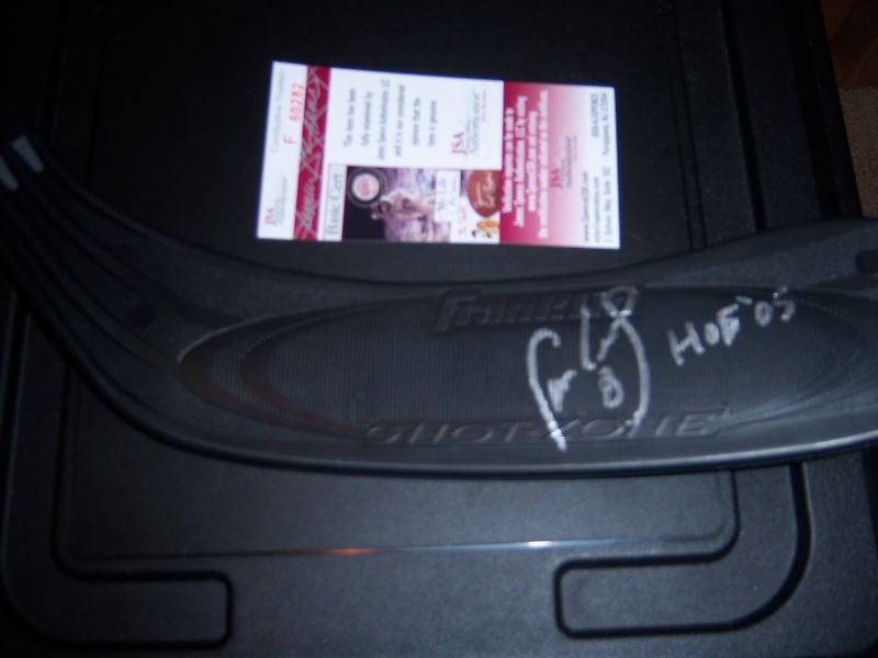 Signed Hockey Stick by Cam Neely with JSA COA Boston Bruins Hall of Fame: Signed Hockey Stick by Cam Neely with JSA COA Boston Bruins Hall of Fame This pre-owned hockey stick end is signed by Cam Neely, a Hall of Fame player for the Boston Bruins. The item is an original, n