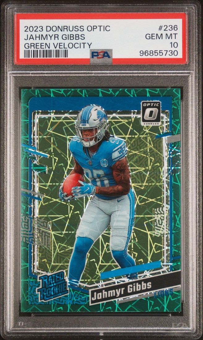 2023 Donruss Optic Jahmyr Gibbs #236 Green Velo RC PSA 10 Football Card: 2023 Donruss Optic Jahmyr Gibbs #236 Green Velo RC PSA 10 Football Card This is a graded 2023 Donruss Optic Jahmyr Gibbs #236 Green Velo RC Football Card, receiving a perfect PSA 10 rating. The card f