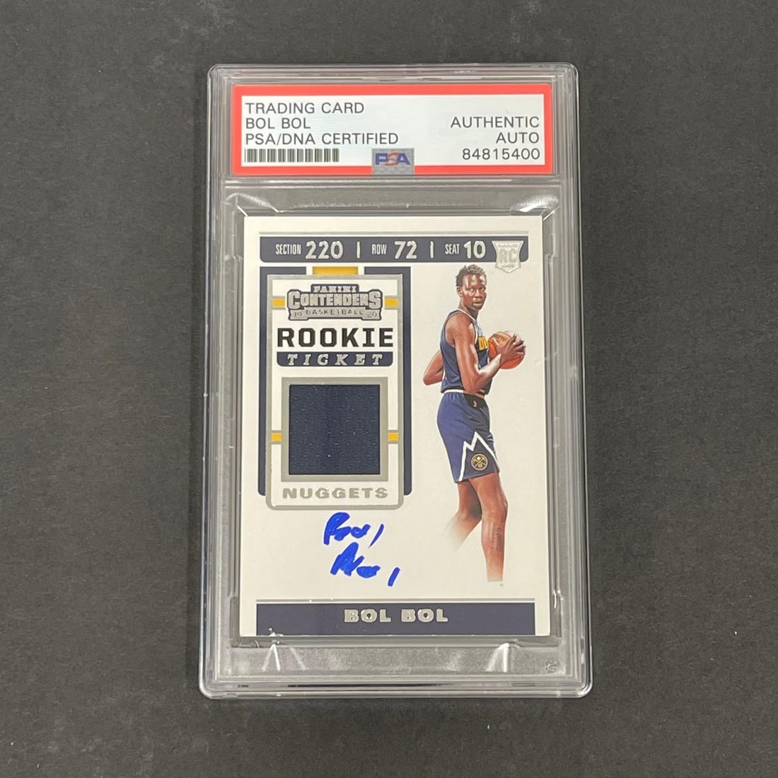 2019 Panini Contenders Rookie Ticket Bol Bol Signed PSA Authenticated: 2019 Panini Contenders Rookie Ticket Bol Bol Signed PSA Authenticated This 2019 Panini Contenders Rookie Ticket #RTS-BOL card features the autograph of Bol Bol, a standout player. The signature has be