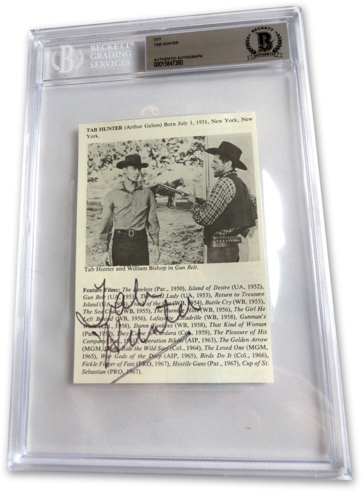 Tab Hunter Beckett Authenticated Signed Magazine Photograph in Slab Case: Tab Hunter Beckett Authenticated Signed Magazine Photograph in Slab Case This is an original magazine photograph autographed by Western actor Tab Hunter. The signed photo comes authenticated by Becket