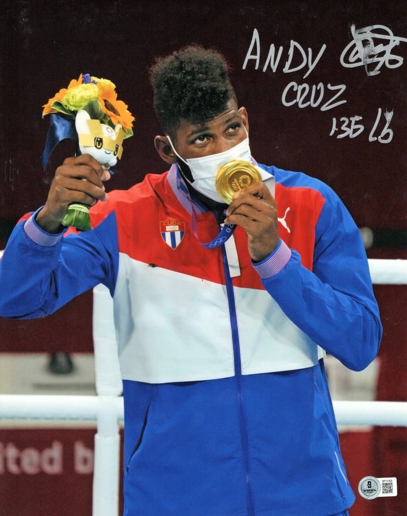 Andy Cruz Gold Medal Autographed 11X14 Boxing Photo Beckett Authenticated: Andy Cruz Gold Medal Autographed 11X14 Boxing Photo Beckett Authenticated This is an authentic 11" x 14" photo of boxer Andy Cruz, featuring his signature and capturing his achievement as a gold medal