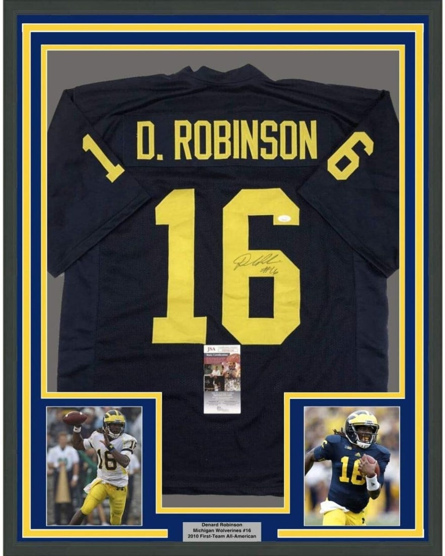 Denard Robinson Signed Michigan Jersey Framed 35x39 with JSA Authentication: Denard Robinson Signed Michigan Jersey Framed 35x39 with JSA Authentication This professionally framed and matted Michigan Wolverines blue jersey features the original autograph of Denard Robinson. Th