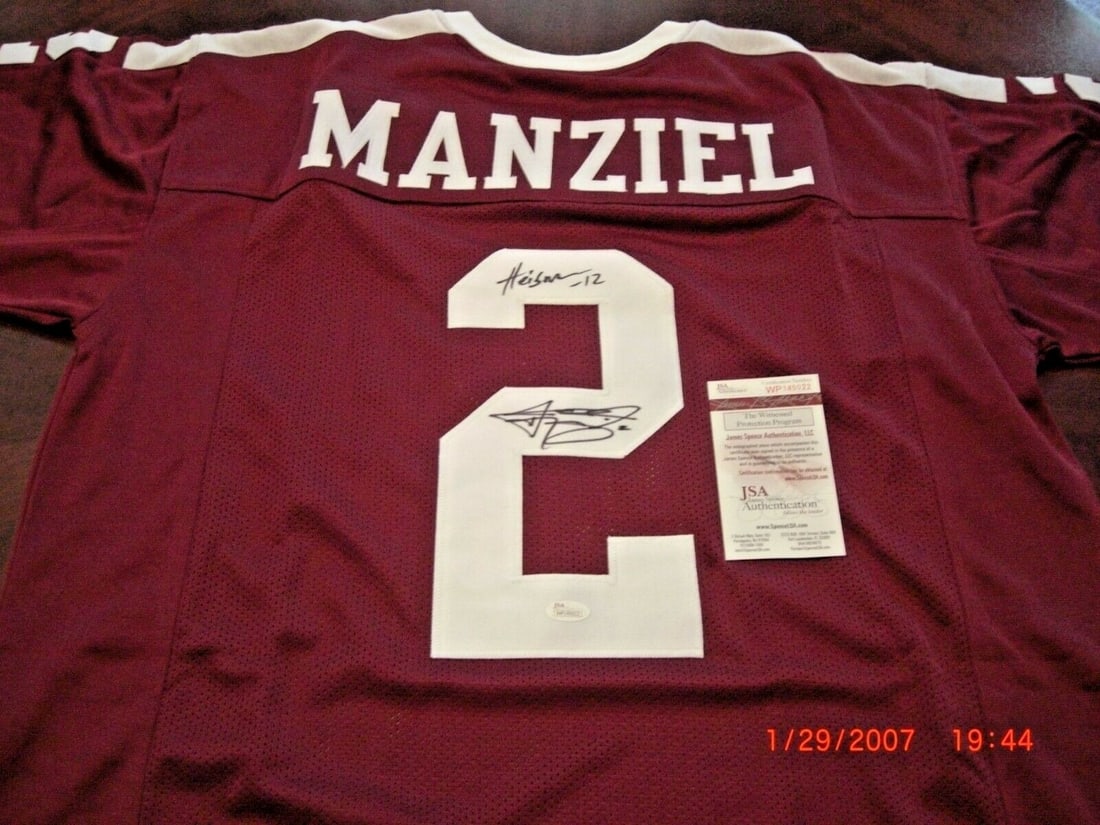 Johnny Manziel 2012 Heisman Signed Texas A&M Jersey JSA COA: Johnny Manziel 2012 Heisman Signed Texas A&M Jersey JSA COA This authentic Texas A&M Aggies jersey, signed by Johnny Manziel, is a must-have for any football fan. Celebrated for winning the Heisman Tr