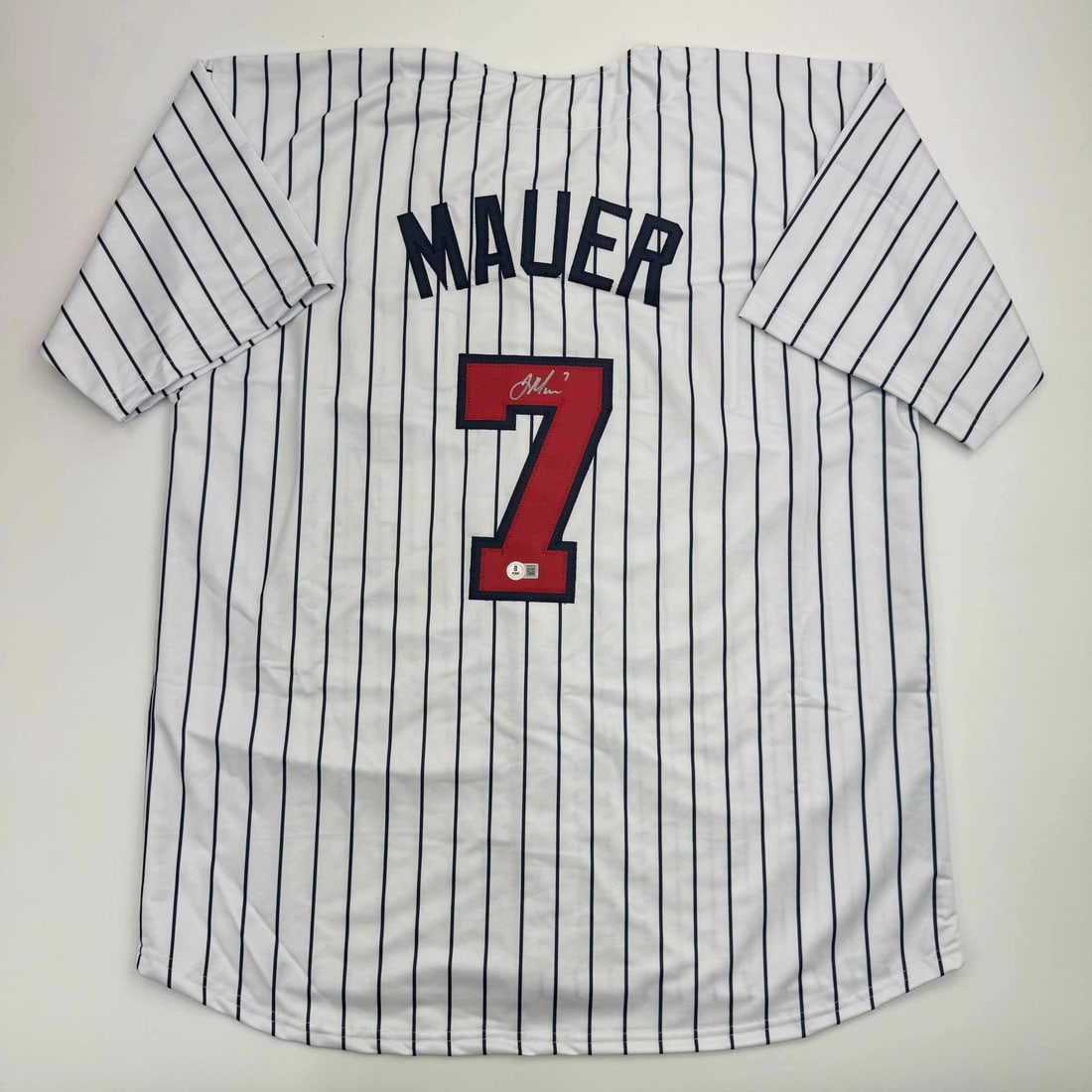 Joe Mauer Autographed Minnesota Twins Pinstripe Jersey Beckett COA: Joe Mauer Autographed Minnesota Twins Pinstripe Jersey Beckett COA Celebrate your admiration for Joe Mauer with this authentic autographed Minnesota Twins pinstripe baseball jersey. This custom jersey