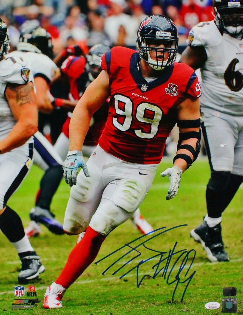 JJ Watt Signed Houston Texans 16x20 Jersey Photo JSA Authentication: JJ Watt Signed Houston Texans 16x20 Jersey Photo JSA Authentication This striking 16x20 photo captures JJ Watt in action, proudly showcasing his autographed red jersey from the Houston Texans. The pho