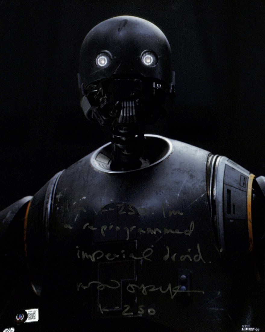 Alan Tudyk Signed 11x14 Photo as K-2SO from Rogue One Beckett Authenticated: Alan Tudyk Signed 11x14 Photo as K-2SO from Rogue One Beckett Authenticated This 11x14 photograph features a silver marker signature and inscription from Alan Tudyk, who voiced K-2SO in "Rogue One: A 