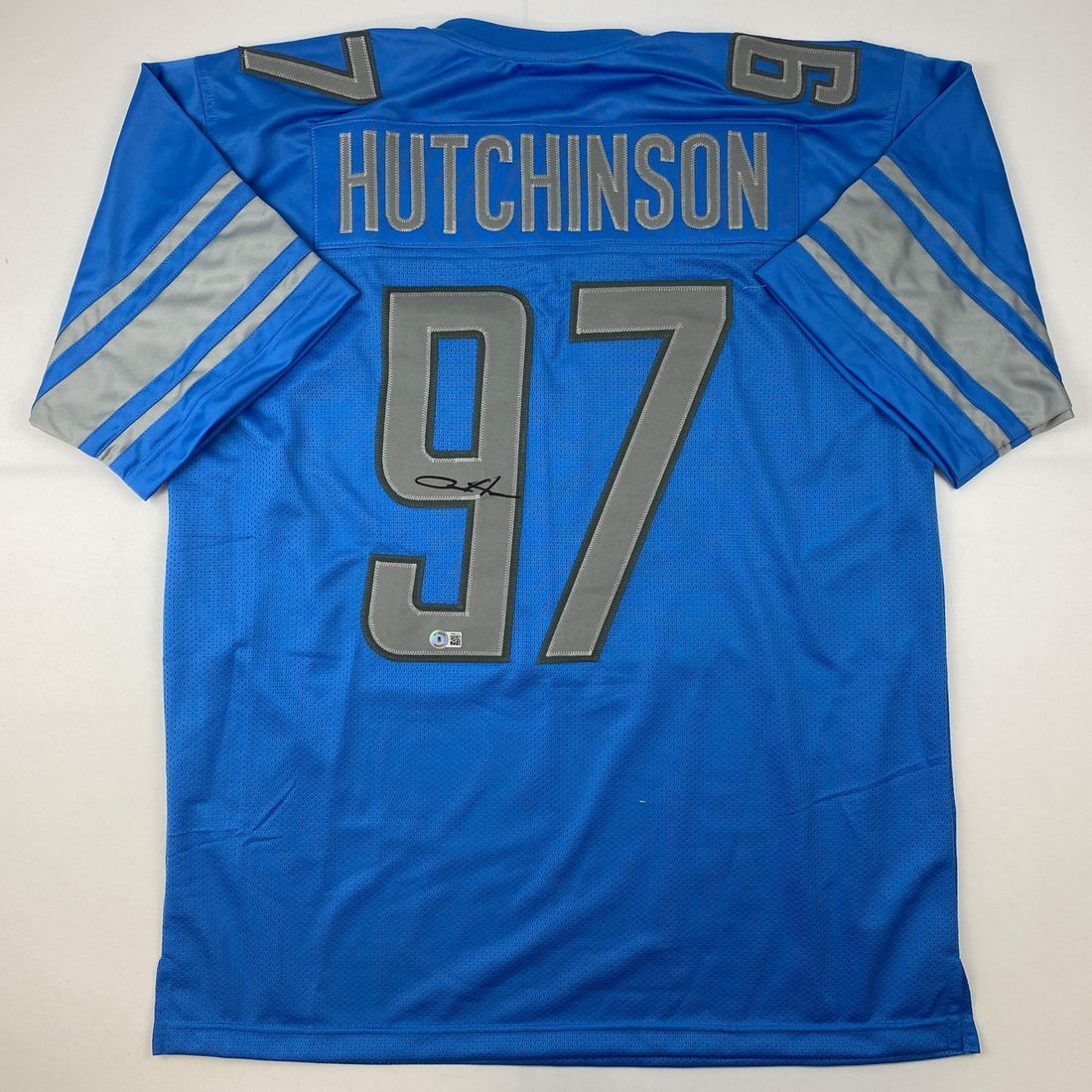 Aidan Hutchinson Signed Detroit Lions Blue Jersey Beckett COA: Aidan Hutchinson Signed Detroit Lions Blue Jersey Beckett COA This autographed Aidan Hutchinson Detroit Lions football jersey is a unique collectible for any fan. The jersey is a custom piece that dis