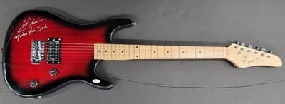 JSA Certified Cassandra Peterson Signed Electric Guitar Elvira: JSA Certified Cassandra Peterson Signed Electric Guitar Elvira This electric guitar features the hand signature of Cassandra Peterson, known for her portrayal of Elvira. The autograph has been authent