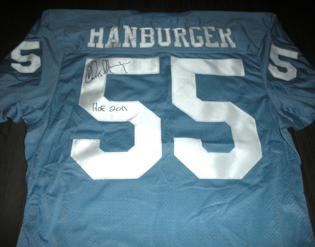 Signed Rawlings North Carolina Football Jersey with COA by Chris Hanburger: Signed Rawlings North Carolina Football Jersey with COA by Chris Hanburger This official licensed Rawlings jersey is signed by Chris Hanburger and comes with a certificate of authenticity. The jersey 