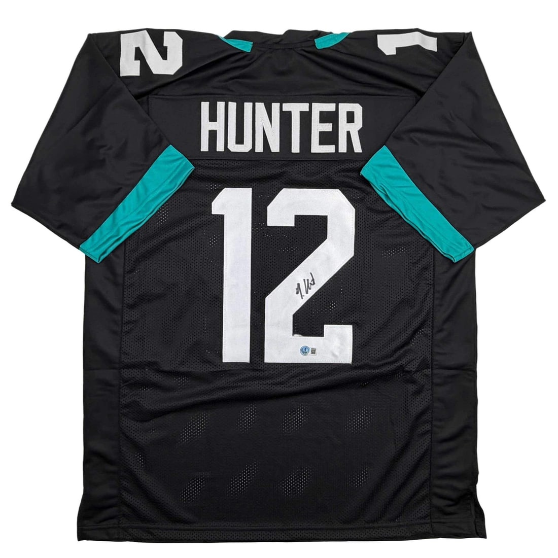 Travis Hunter Autographed Jacksonville Jaguars Black Jersey Beckett COA: Travis Hunter Autographed Jacksonville Jaguars Black Jersey Beckett COA This is an authentic autographed black jersey of Travis Hunter, featuring his name and number, ideal for collectors. The jersey 
