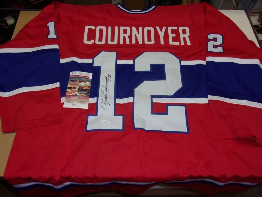 Signed Yvan Cournoyer Montreal Canadiens Jersey JSA COA Hall of Fame 1982: Signed Yvan Cournoyer Montreal Canadiens Jersey JSA COA Hall of Fame 1982 This is a pre-owned, original Montreal Canadiens hockey jersey signed by Yvan Cournoyer. The jersey commemorates his induction