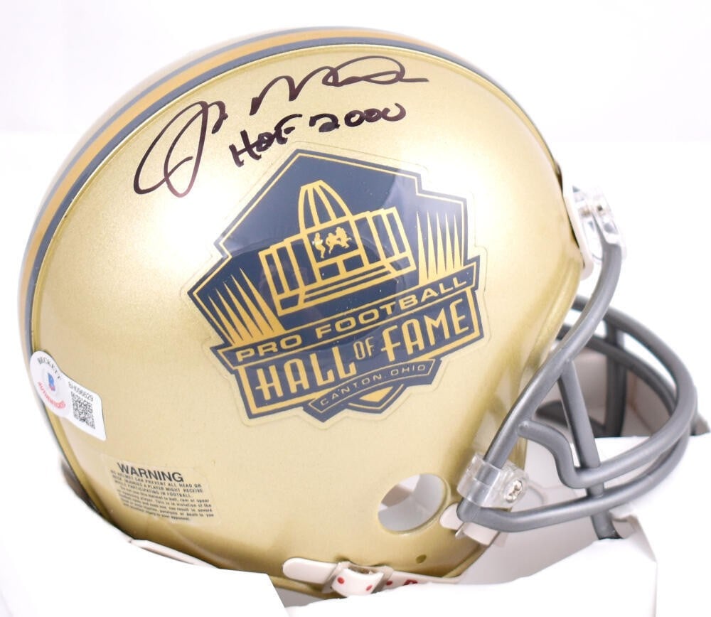 Joe Montana Autographed Mini Helmet NFL Gold HOF Beckett Certified: Joe Montana Autographed Mini Helmet NFL Gold HOF Beckett Certified This authentic mini helmet commemorates Joe Montana, a legendary player in NFL history. The helmet features a high-quality gold finis