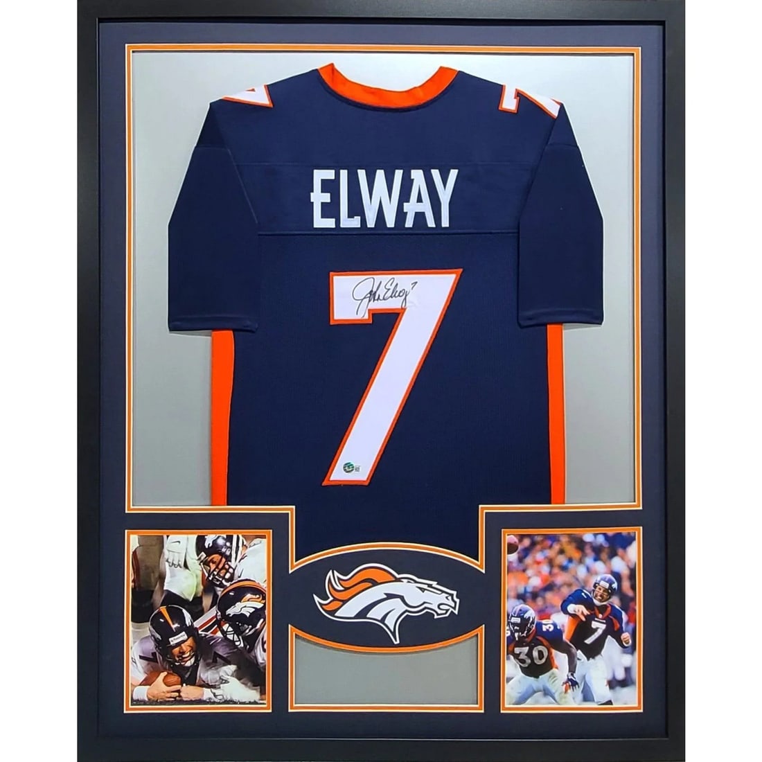 Framed Denver Broncos Jersey Signed by John Elway Beckett Authenticated: Framed Denver Broncos Jersey Signed by John Elway Beckett Authenticated This is a framed Denver Broncos jersey autographed by John Elway. Authenticated by Beckett, the jersey includes a tamper-proof s