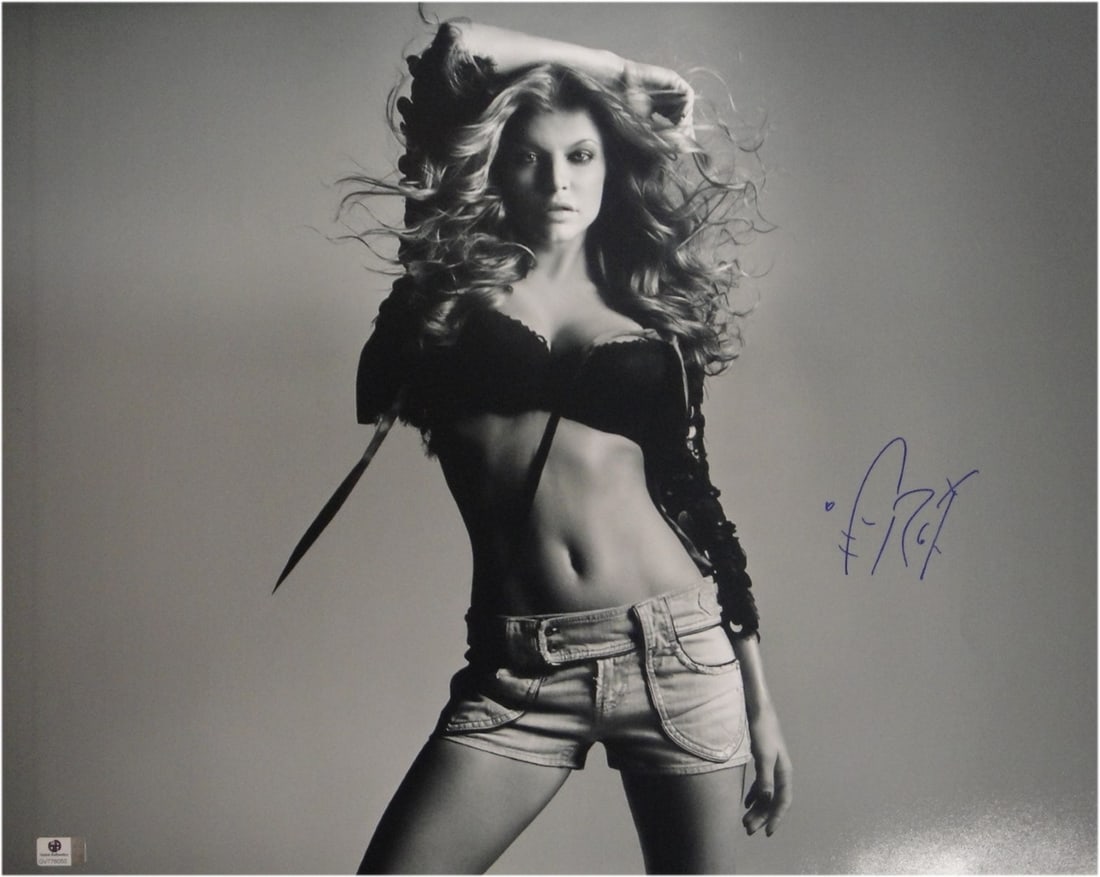 Fergie Autographed 16X20 B/W Photo Authenticated by Global Authentics: Fergie Autographed 16X20 B/W Photo Authenticated by Global Authentics This stunning 16x20 black and white photograph features Fergie, the iconic singer from the Black Eyed Peas, in a sexy pose. This p