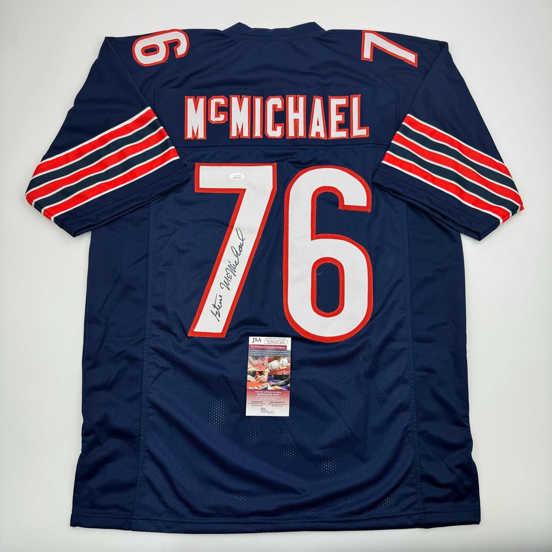 Steve McMichael Autographed Chicago Bears Football Jersey JSA COA: Steve McMichael Autographed Chicago Bears Football Jersey JSA COA This is an autographed Chicago Blue Football Jersey signed by NFL player Steve McMichael, featuring a James Spence Authentication (JSA