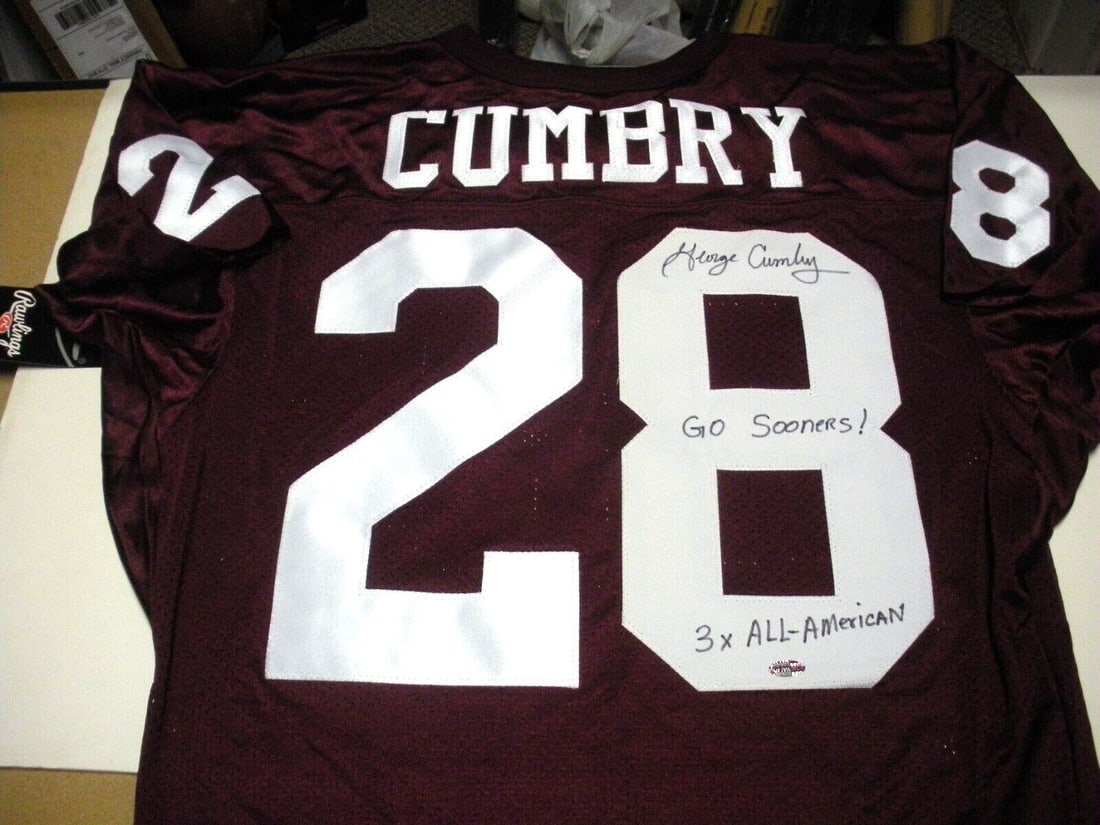 Signed Rawlings Oklahoma Sooners Football Jersey George Cumby With COA: Signed Rawlings Oklahoma Sooners Football Jersey George Cumby With COA This is a pre-owned, officially licensed Rawlings jersey signed by George Cumbry of the Oklahoma Sooners. The jersey comes with a