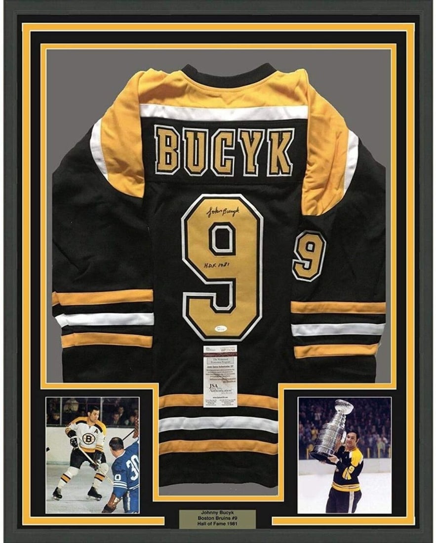 Framed Autographed Johnny Bucyk Jersey Boston Bruins JSA COA 33x42: Framed Autographed Johnny Bucyk Jersey Boston Bruins JSA COA 33x42 Celebrate the legacy of Johnny Bucyk with this professionally framed and autographed Boston Bruins hockey jersey. This item features 