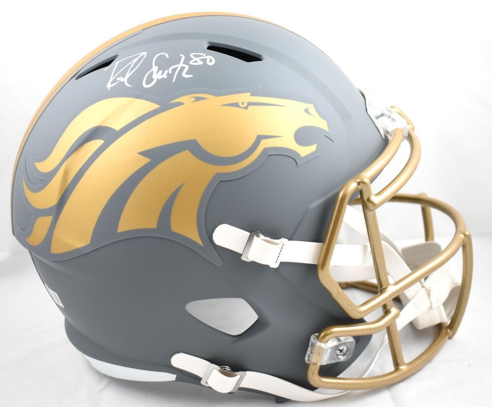 Rod Smith Signed Denver Broncos Full Size Helmet Beckett Authenticated: Rod Smith Signed Denver Broncos Full Size Helmet Beckett Authenticated This is a full-size slate speed helmet autographed by Rod Smith, a renowned player from the Denver Broncos. The helmet is authent