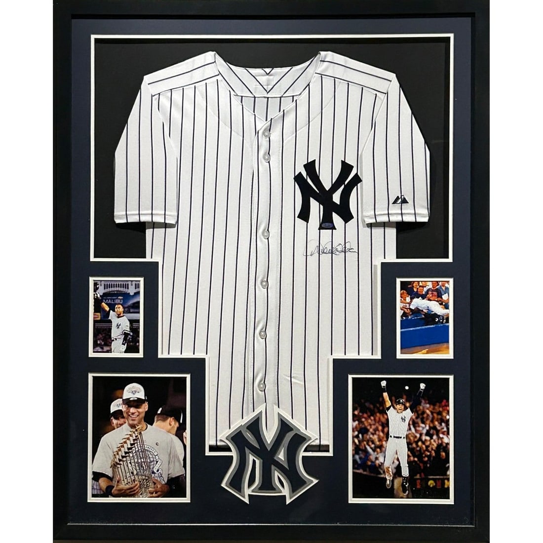 Derek Jeter Signed Framed Rookie Jersey Authenticated by Steiner: Derek Jeter Signed Framed Rookie Jersey Authenticated by Steiner This is a framed autographed rookie jersey of Derek Jeter, renowned for his exceptional career with the New York Yankees. Authenticated