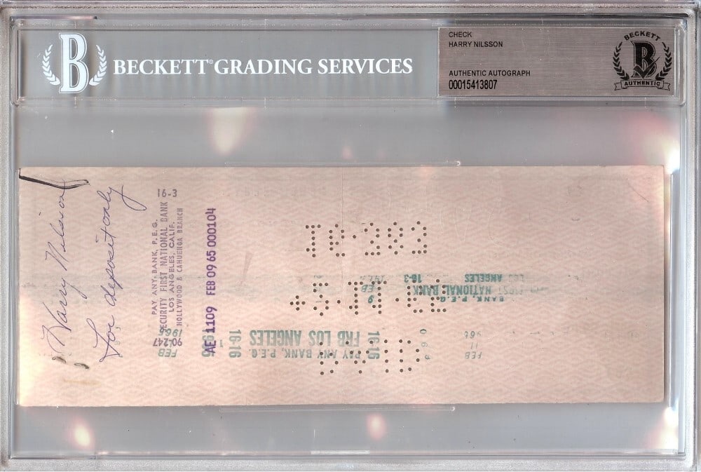 Bank Check Signed by Harry Nilsson with Beckett Authentication: Bank Check Signed by Harry Nilsson with Beckett Authentication This is an original bank check autographed by renowned singer-songwriter Harry Nilsson. The item has been authenticated and encased by Be