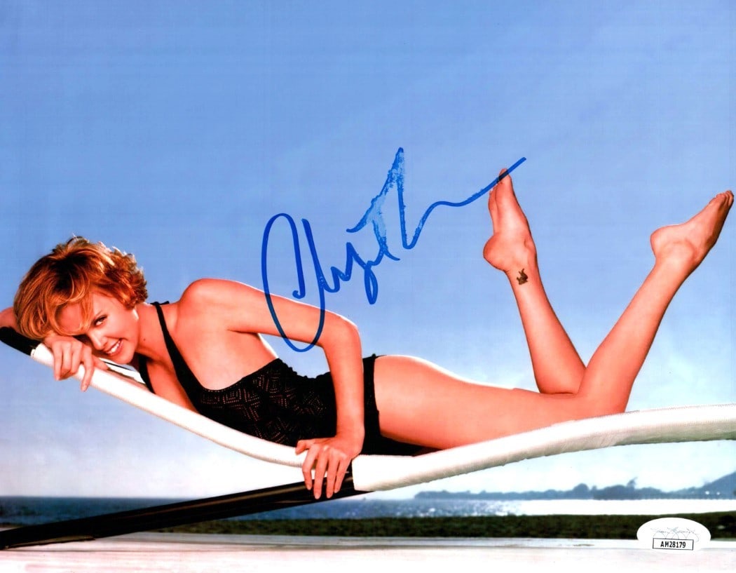 Charlize Theron JSA Authenticated Signed 8x10 Photograph With Deck Chair Scene: Charlize Theron JSA Authenticated Signed 8x10 Photograph With Deck Chair Scene This 8x10 photograph features an authentic autograph by Charlize Theron. The photo, depicting her in a deck chair, is an 