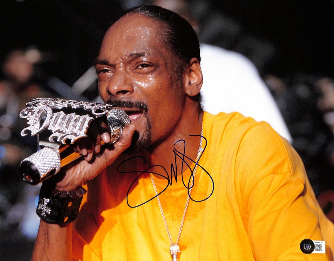 Snoop Dogg Signed 11x14 Photograph Beckett Certified: Snoop Dogg Signed 11x14 Photograph Beckett Certified This is an authentic 11X14 photograph signed by renowned rapper Snoop Dogg. The signature is inscribed and was executed in permanent marker by Kerr