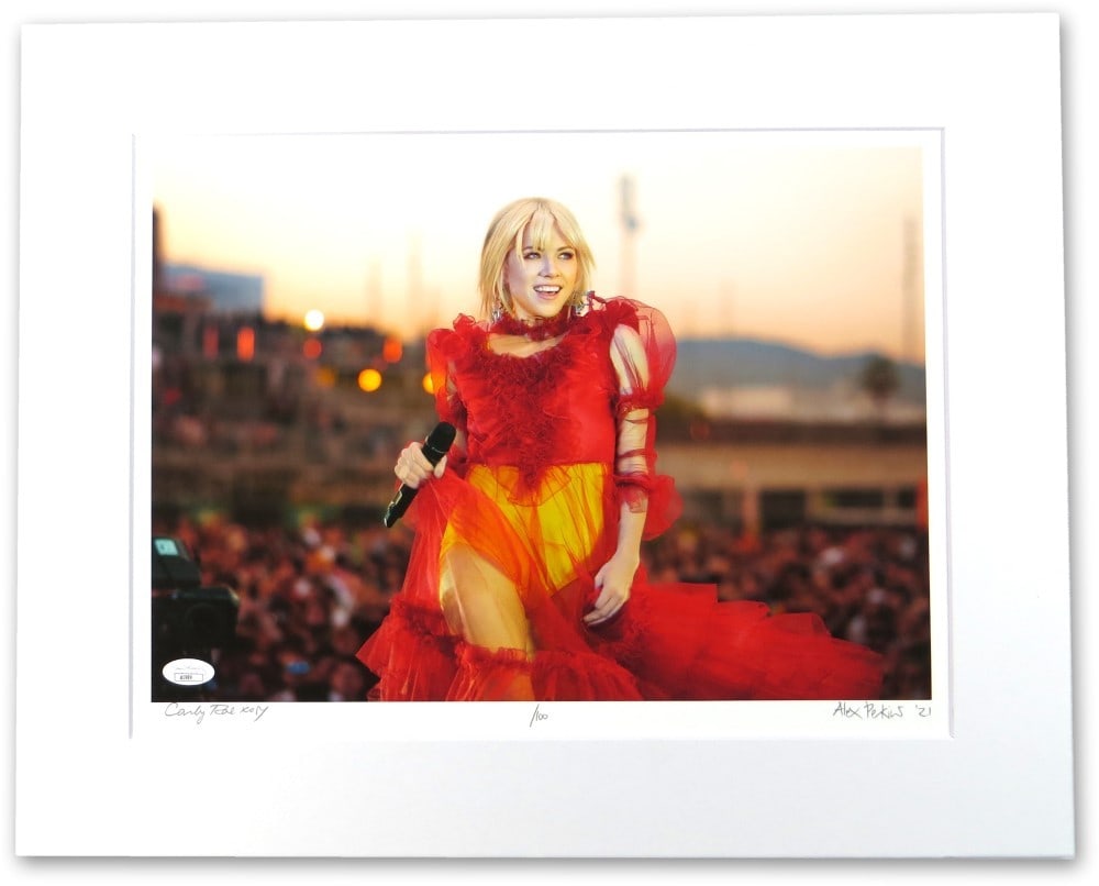 Matted Photo Lithograph Signed by Carly Rae Jepsen and Photographer JSA Authenticated: Matted Photo Lithograph Signed by Carly Rae Jepsen and Photographer JSA Authenticated This is a Carly Rae Jepsen autographed matted photo lithograph, also signed by the photographer. The lithograph me