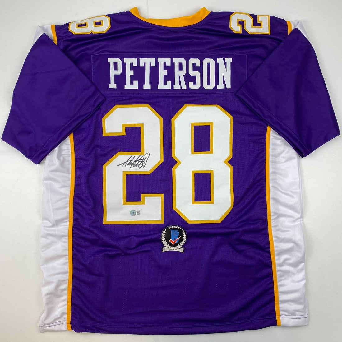 Adrian Peterson Signed Minnesota Vikings Purple Jersey Beckett COA: Adrian Peterson Signed Minnesota Vikings Purple Jersey Beckett COA Celebrate your love for football with this autographed Adrian Peterson Minnesota Vikings purple jersey. Featuring the player's name a