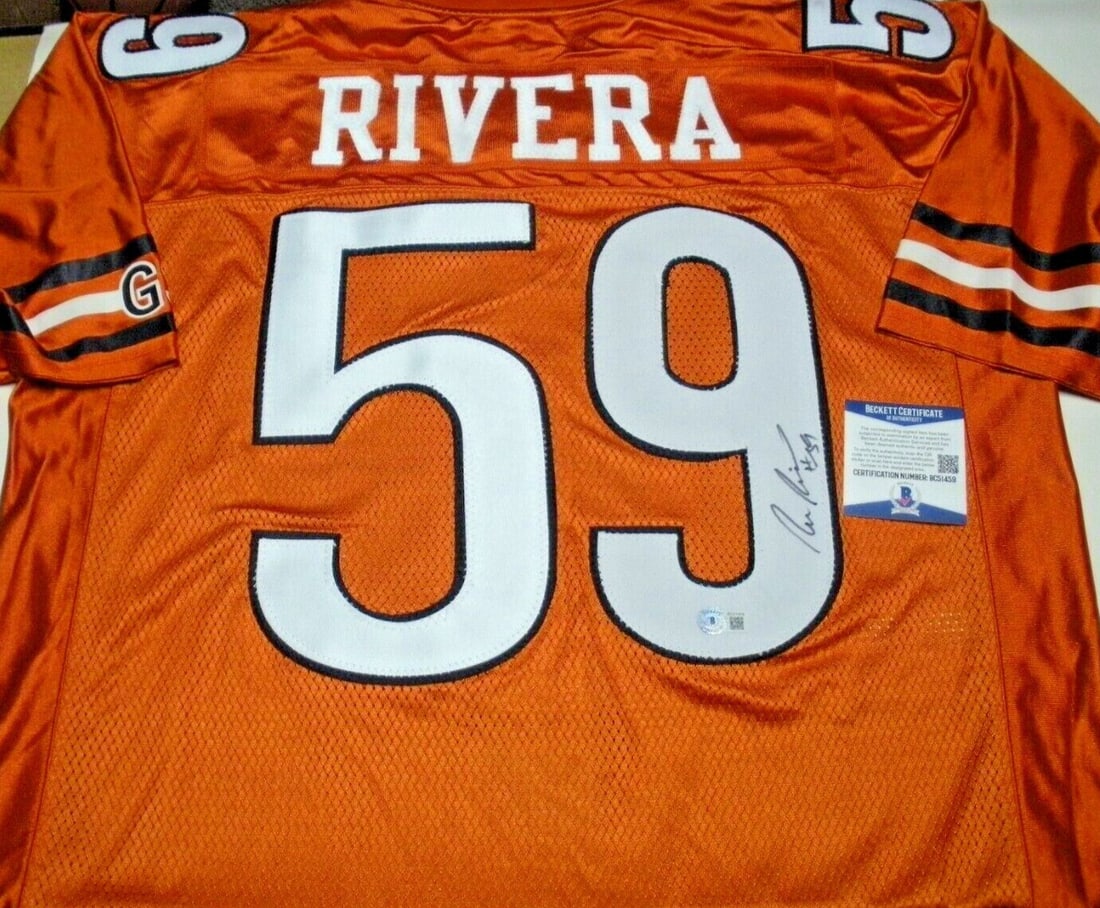 Ron Rivera Chicago Bears Signed Reebok Jersey with COA: Ron Rivera Chicago Bears Signed Reebok Jersey with COA Officially licensed Reebok jersey signed by Ron Rivera, a celebrated player of the Chicago Bears. This original jersey is a commemorative piece f