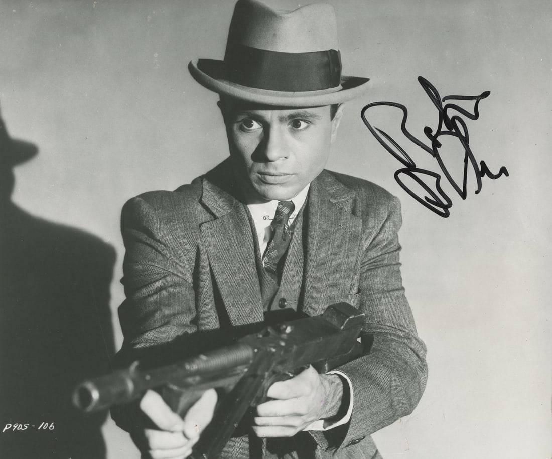 Robert Blake The Purple Gang Signed 7x8.5 Photo Beckett Authenticated: Robert Blake The Purple Gang Signed 7x8.5 Photo Beckett Authenticated This authentic 7x8.5 photograph features the signature of Robert Blake, a notable member of The Purple Gang. The item is certified