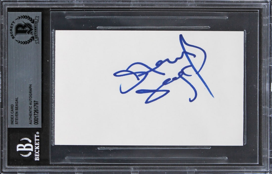 Steven Seagal Autograph on 3x5 Index Card Beckett Slabbed Under Siege: Steven Seagal Autograph on 3x5 Index Card Beckett Slabbed Under Siege This 3x5 index card is hand signed in blue ink by Steven Seagal and is associated with the film Under Siege. Each autograph is uni