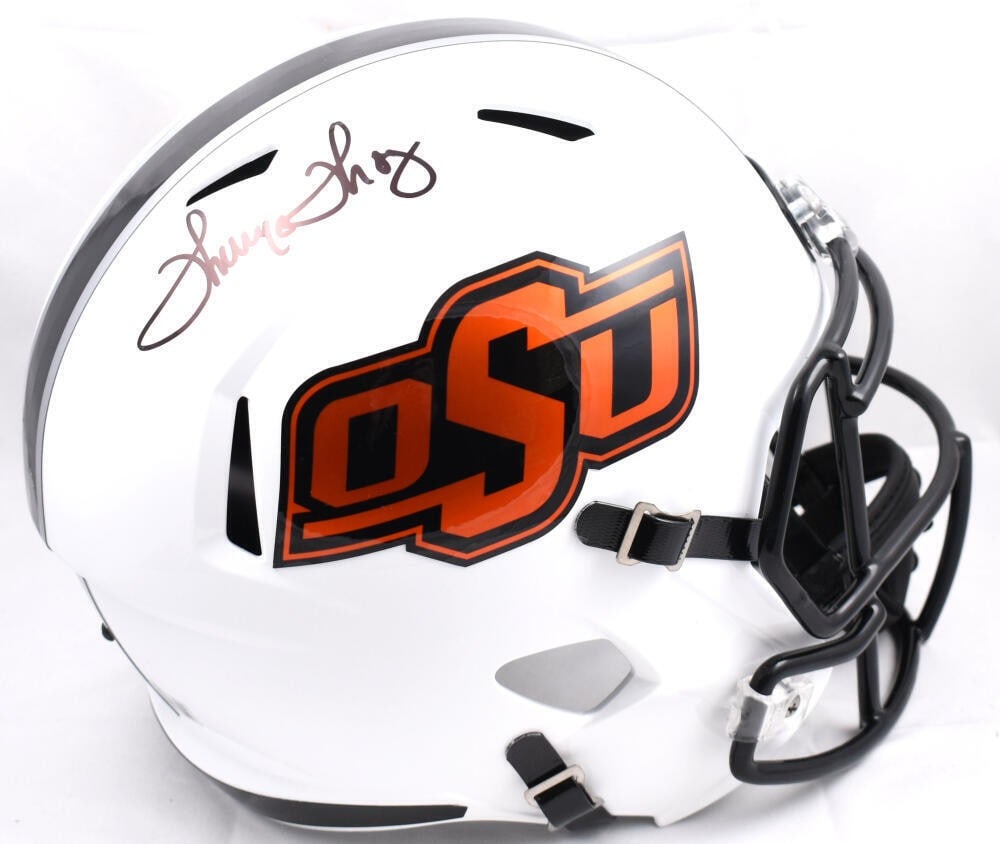 Oklahoma State Cowboys Helmet Signed by Thurman Thomas Beckett Authenticated: Oklahoma State Cowboys Helmet Signed by Thurman Thomas Beckett Authenticated This full-size Oklahoma State Cowboys Speed helmet features the authentic signature of Thurman Thomas. The autograph has be