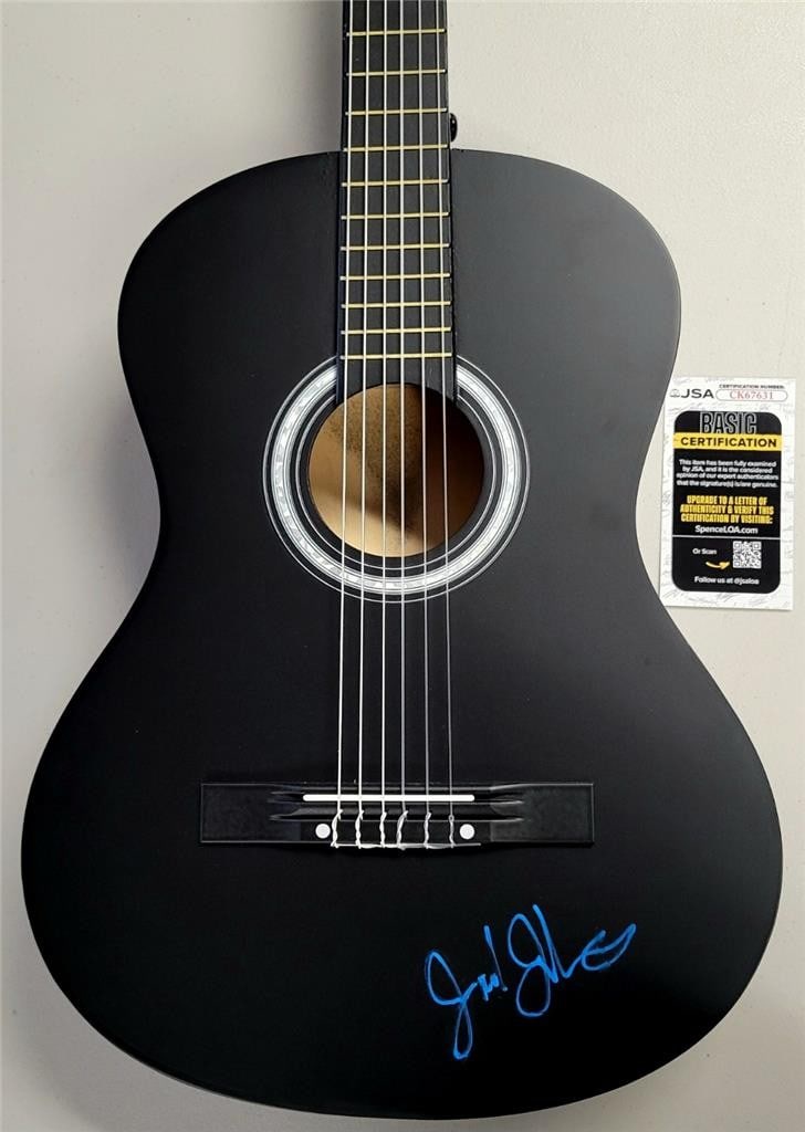 Full Size Acoustic Guitar Autographed by Jack Johnson JSA Authenticated: Full Size Acoustic Guitar Autographed by Jack Johnson JSA Authenticated This full size acoustic guitar features the authentic autograph of Jack Johnson. The signature is verified by James Spence Authe