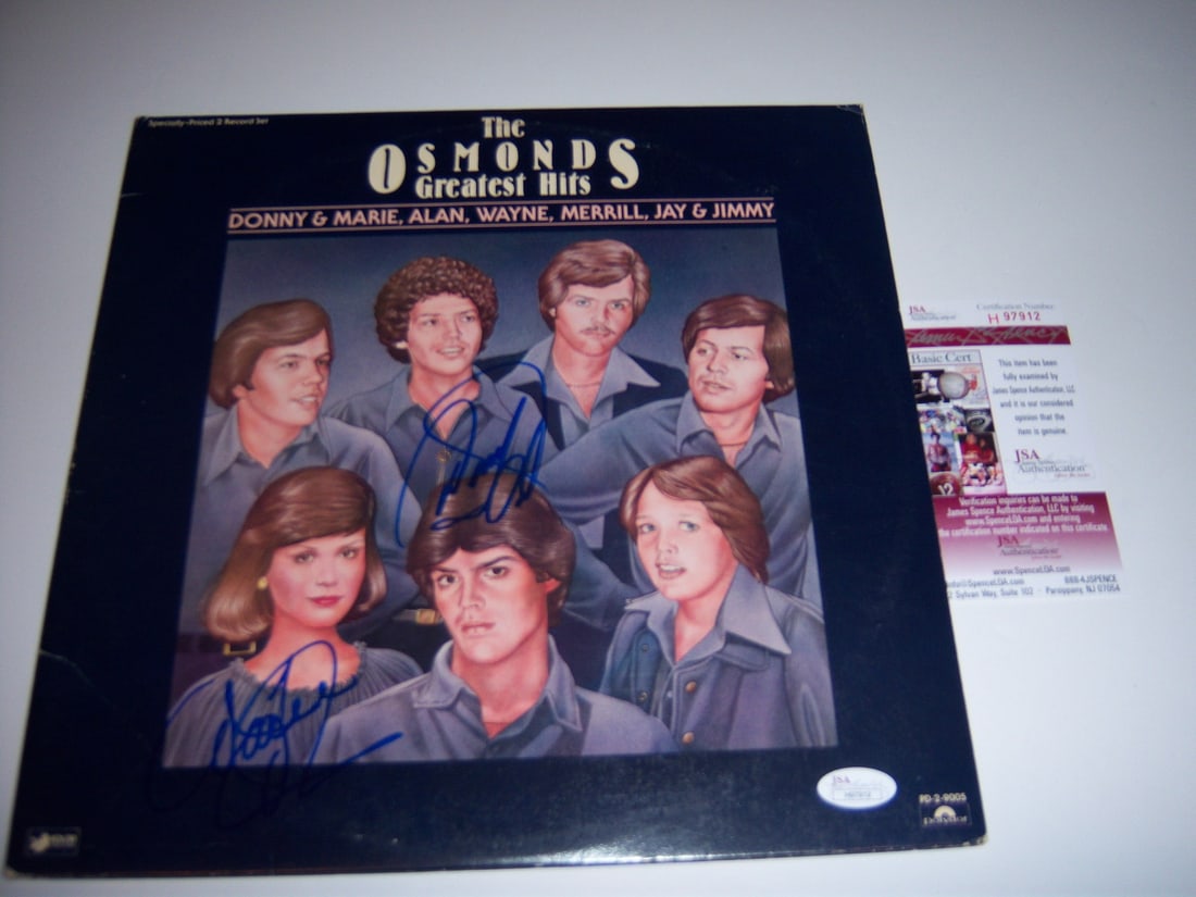 Signed Donny and Marie Osmond Greatest Hits Vinyl Album with JSA COA: Signed Donny and Marie Osmond Greatest Hits Vinyl Album with JSA COA This is an original Donny and Marie Osmond "The Osmonds Greatest Hits" LP record album, signed as indicated in the title. The item 