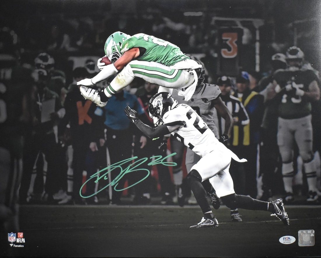 Saquon Barkley Signed The Leap 16x20 Eagles Photo PSA DNA Authenticated: Saquon Barkley Signed The Leap 16x20 Eagles Photo PSA DNA Authenticated This 16x20 photograph, titled "The Leap," features NFL player Saquon Barkley and is autographed by him. The photo captures Barkl