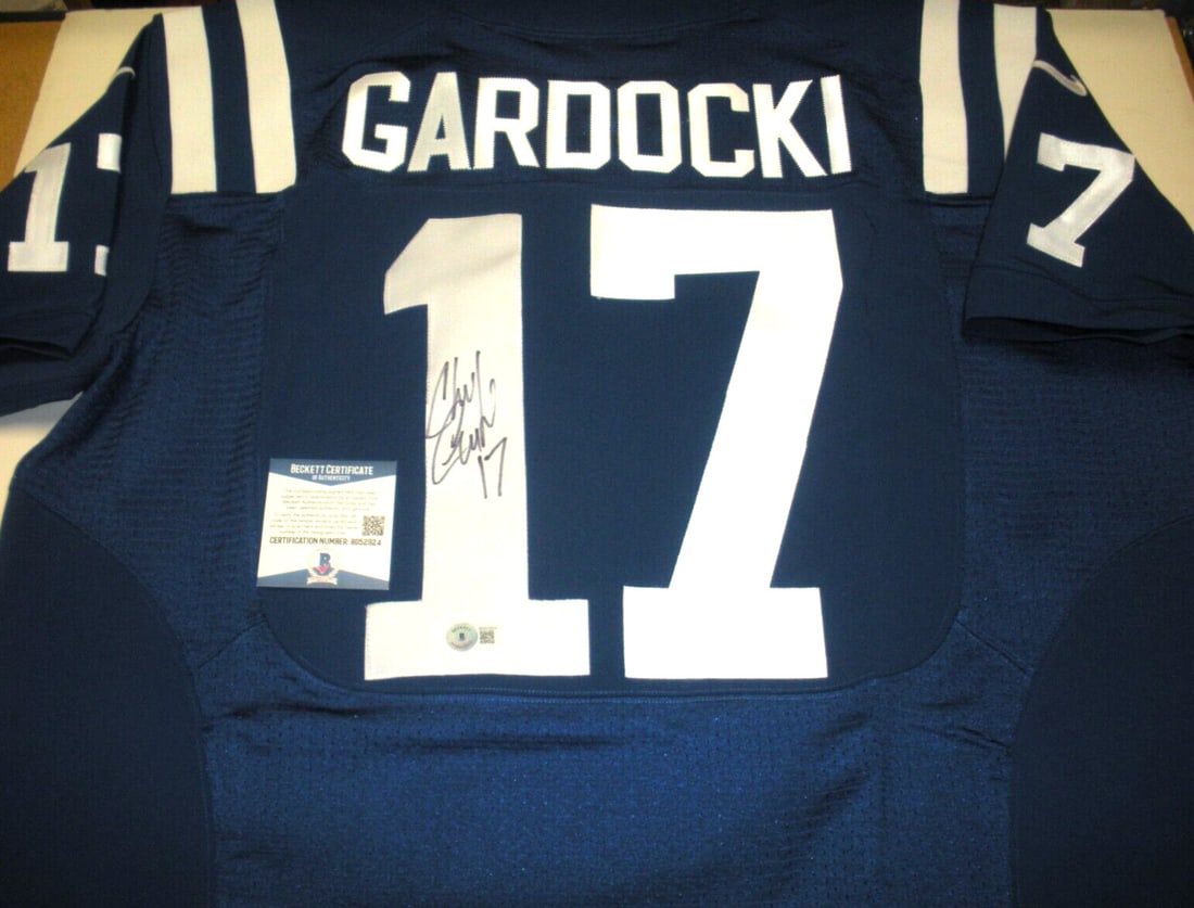 Chris Gardocki Signed Nike Colts Jersey with Beckett COA: Chris Gardocki Signed Nike Colts Jersey with Beckett COA This official licensed Nike jersey is signed by Chris Gardocki from the Indianapolis Colts. It is an original NFL football collectible and come
