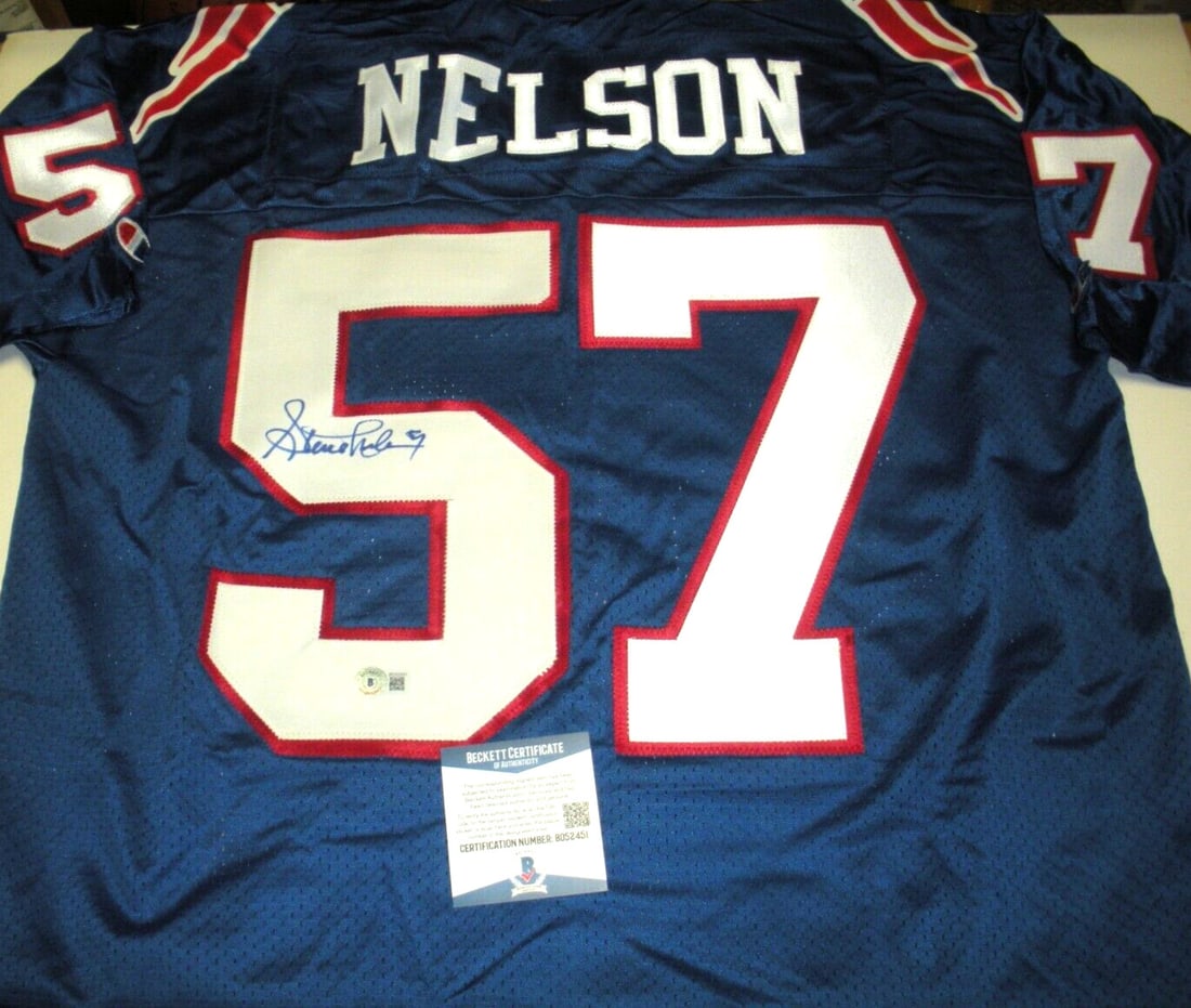 Steve Nelson Signed New England Patriots Jersey with Beckett COA: Steve Nelson Signed New England Patriots Jersey with Beckett COA This official licensed Champion jersey features the signature of Steve Nelson, a distinguished player for the New England Patriots. Cer