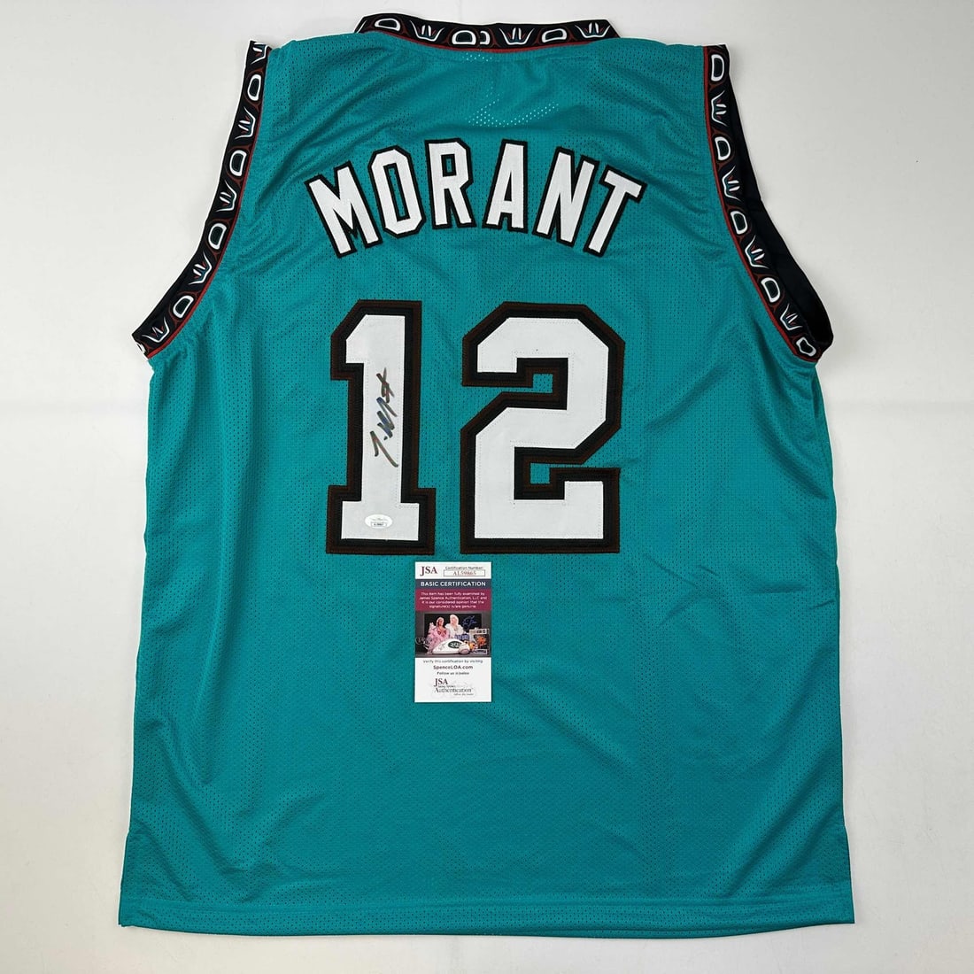 Ja Morant Autographed Memphis Grizzlies Teal Jersey JSA COA: Ja Morant Autographed Memphis Grizzlies Teal Jersey JSA COA Celebrate the talent of Ja Morant with this autographed Memphis Grizzlies teal basketball jersey. This original custom jersey features the p
