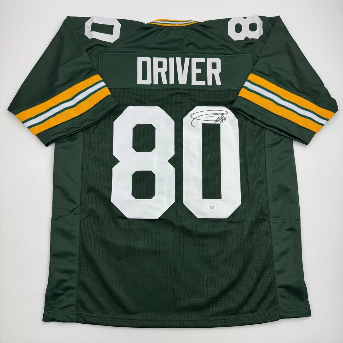 Signed Donald Driver Custom Green Football Jersey with JSA Authentication: Signed Donald Driver Custom Green Football Jersey with JSA Authentication This is a custom Green Bay Packers green football jersey autographed by Donald Driver. The jersey features Driver's name and n