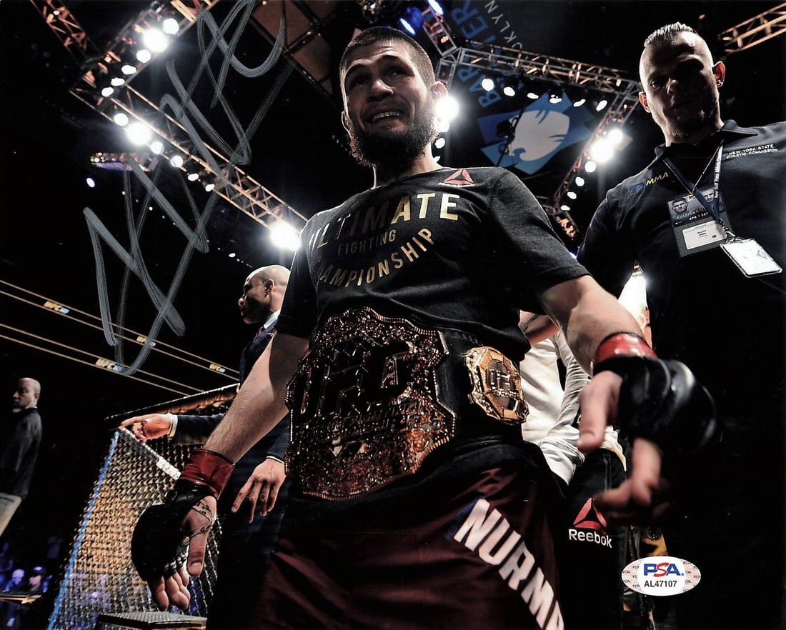 Khabib Nurmagomedov Autographed 8x10 Photo PSA/DNA MMA Collectible: Khabib Nurmagomedov Autographed 8x10 Photo PSA/DNA MMA Collectible This is an original 8x10 photograph of Khabib Nurmagomedov, a prominent UFC fighter, featuring his authentic signature. The autograph