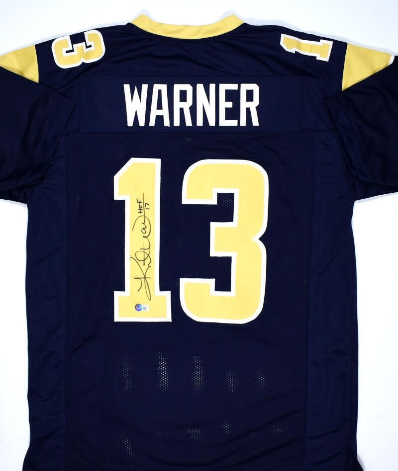 Kurt Warner Signed Pro Style Jersey St. Louis Rams Beckett Hologram: Kurt Warner Signed Pro Style Jersey St. Louis Rams Beckett Hologram This stunning blue and gold pro-style jersey, personally autographed by NFL legend Kurt Warner, celebrates his outstanding career wi
